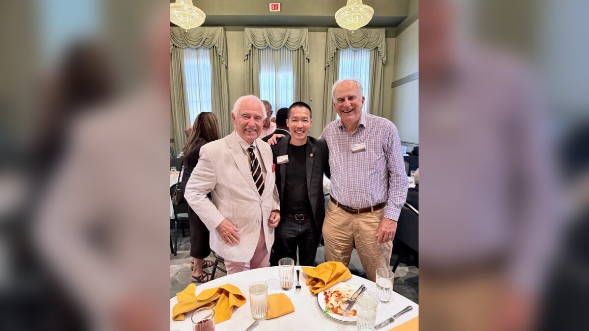 Di Tran at a Rotary Club of Louisville civic lunch with Louisville public-service figures Fred Cowan and Lacey Smith.